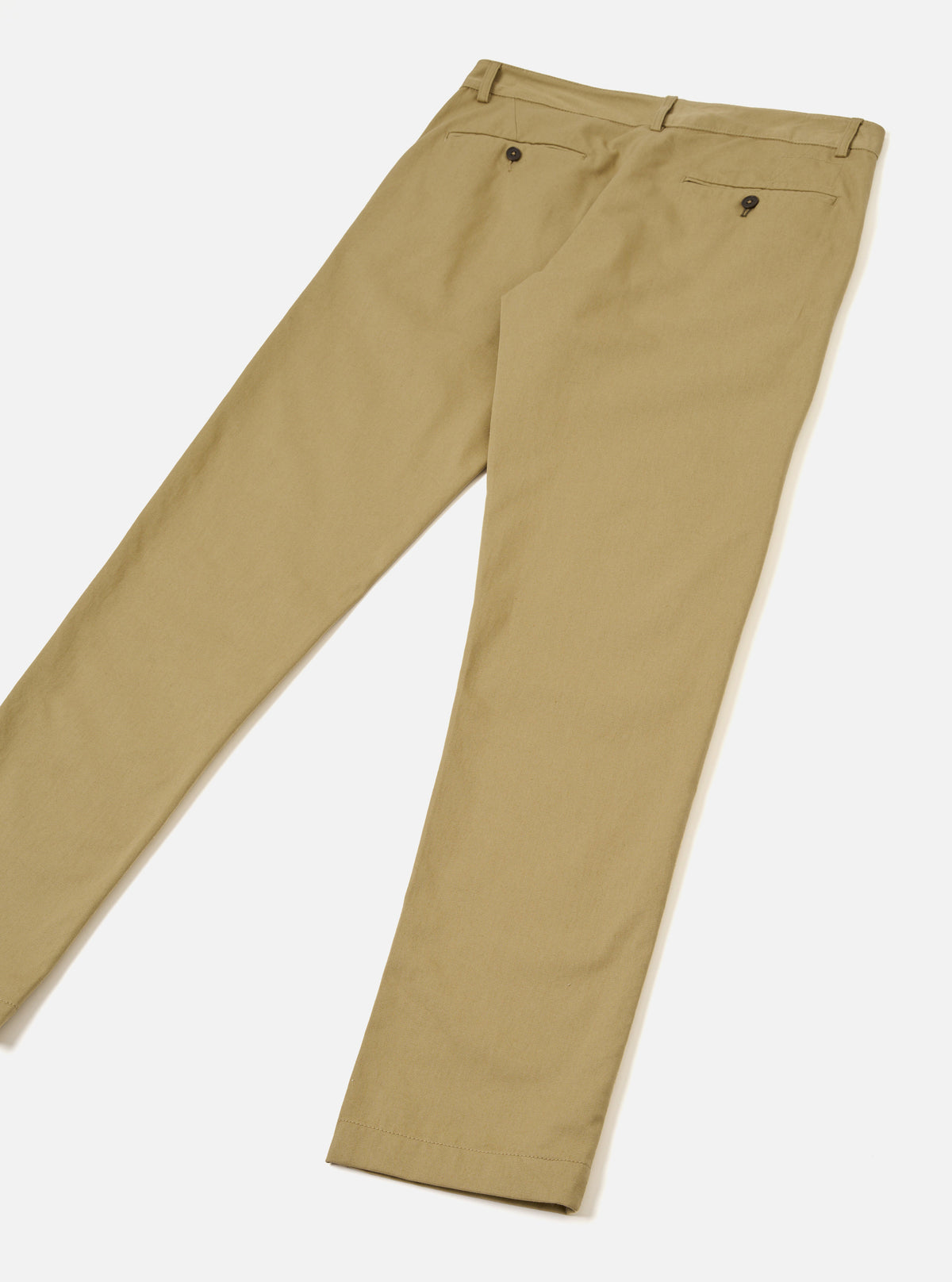 Back view of the Sand Twill Aston Pant displayed flat against a plain white backdrop. Features twin buttoned flap pockets on the rear, neat seam stitching, straight leg tailoring, and rich tan sand-colored cotton twill fabric.