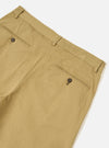 Detailed close-up shot of the front waist section of the Sand Twill Aston Pant on a white background. Emphasizes the zip fly closure, sturdy waistband stitching, front pocket entry, and natural tan twill cotton weave texture.
