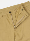 Close-up rear detail shot of the Sand Twill Aston Pant set against a clean white backdrop. Highlights the rear flap pockets with button fastenings, clean tailored seams, and fine sand-colored 3/1 cotton twill weave fabric.