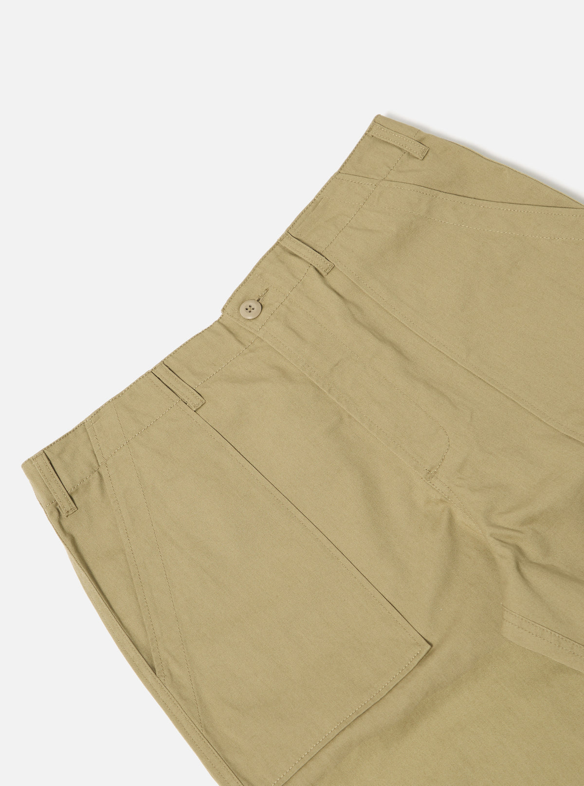 Close-up of the Sand Twill Fatigue Pant on a white background. The sand-colored twill material shows the details of the pockets, seams, and button closure.