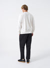 A model wears the Black Twill Hi Water Trouser set against a clean white background. The rear perspective showcases the back patch pockets, comfortable elasticated waistband, relaxed fit, and cropped hem above the ankles.