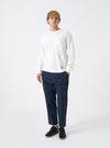 A model wears the Navy Twill Hi Water Trouser against a bright white background. The full-length front view highlights the loose relaxed fit, drawcord waist, dark navy twill texture, and cropped leg opening sitting above the ankle.