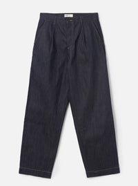 Full-length front shot of a male model wearing the Indigo 13oz Selvedge Denim Duke Pant - Longer Length against a plain off-white background. The image displays the loose, wide fit, double pleats, dark blue denim, and turned-up hems.