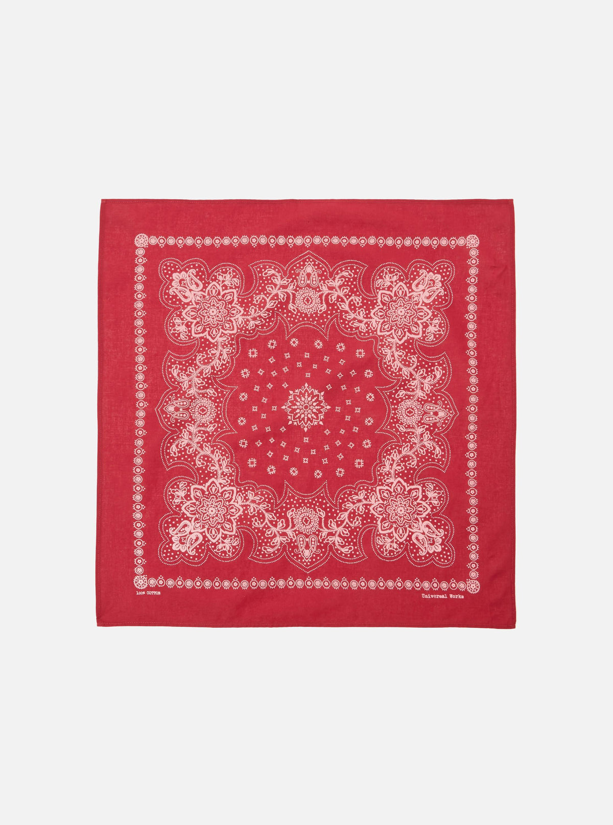 The Red Classic Bandana Neckerchief, a square of red cotton with a white paisley pattern, is displayed on a white background.