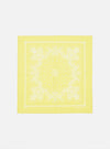 Laid flat on a white surface, this Yellow Classic Bandana Neckerchief features a white floral paisley print. Versatile accessory for a pop of color.