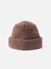 Close-up of the cableami® Brown Toque Boa Cap on a white background. The brown, textured hat has a rounded shape and a soft, plush appearance.