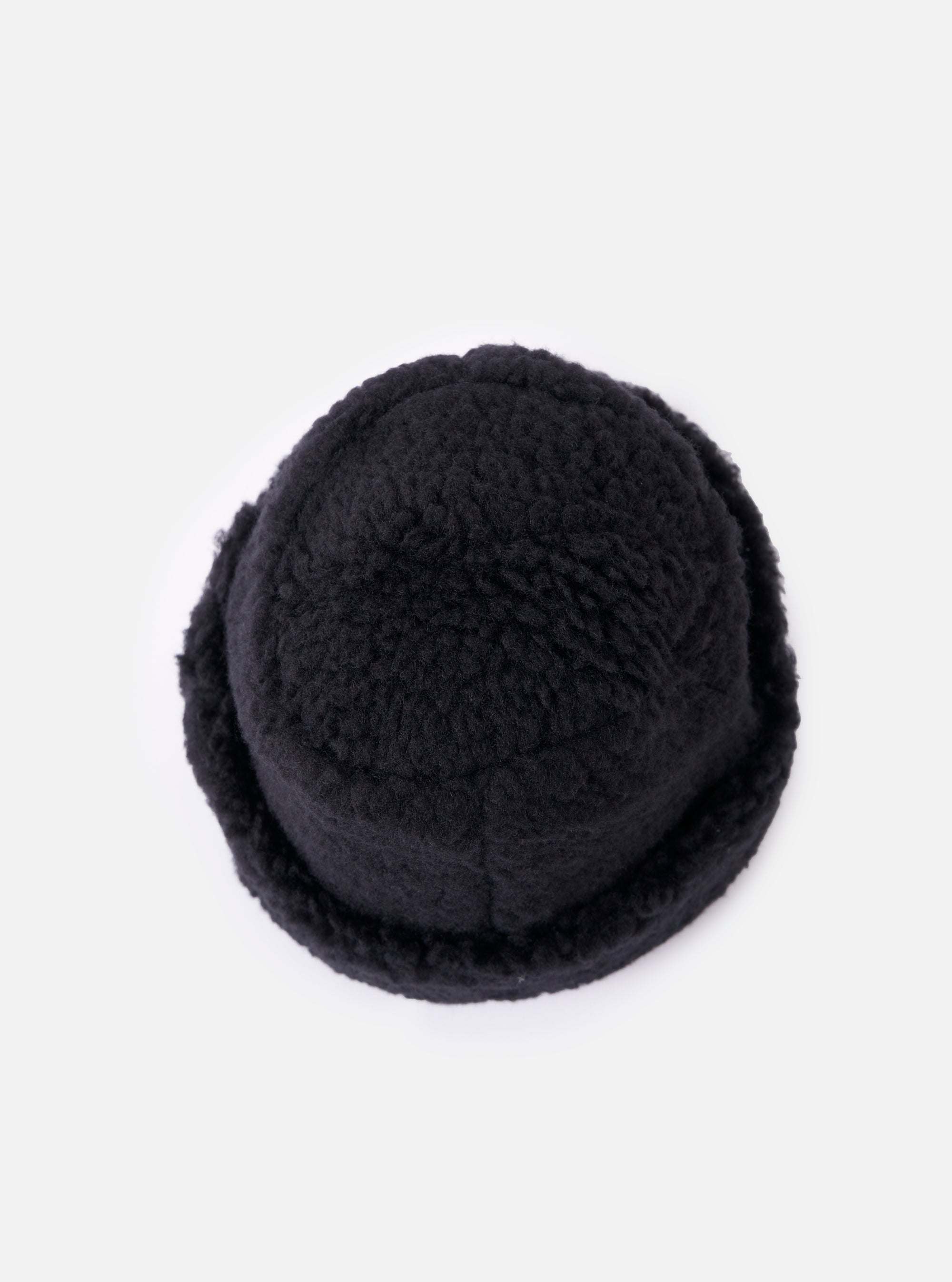 Close-up of the cableami® Black Toque Boa Cap on a white background. The black boa material gives the cap a soft, textured look.