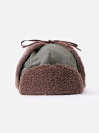Close-up of cableami® Olive Military Nylon Twill Boa Aviator hat. Olive nylon with brown boa trim and tie. Shot on a white background.