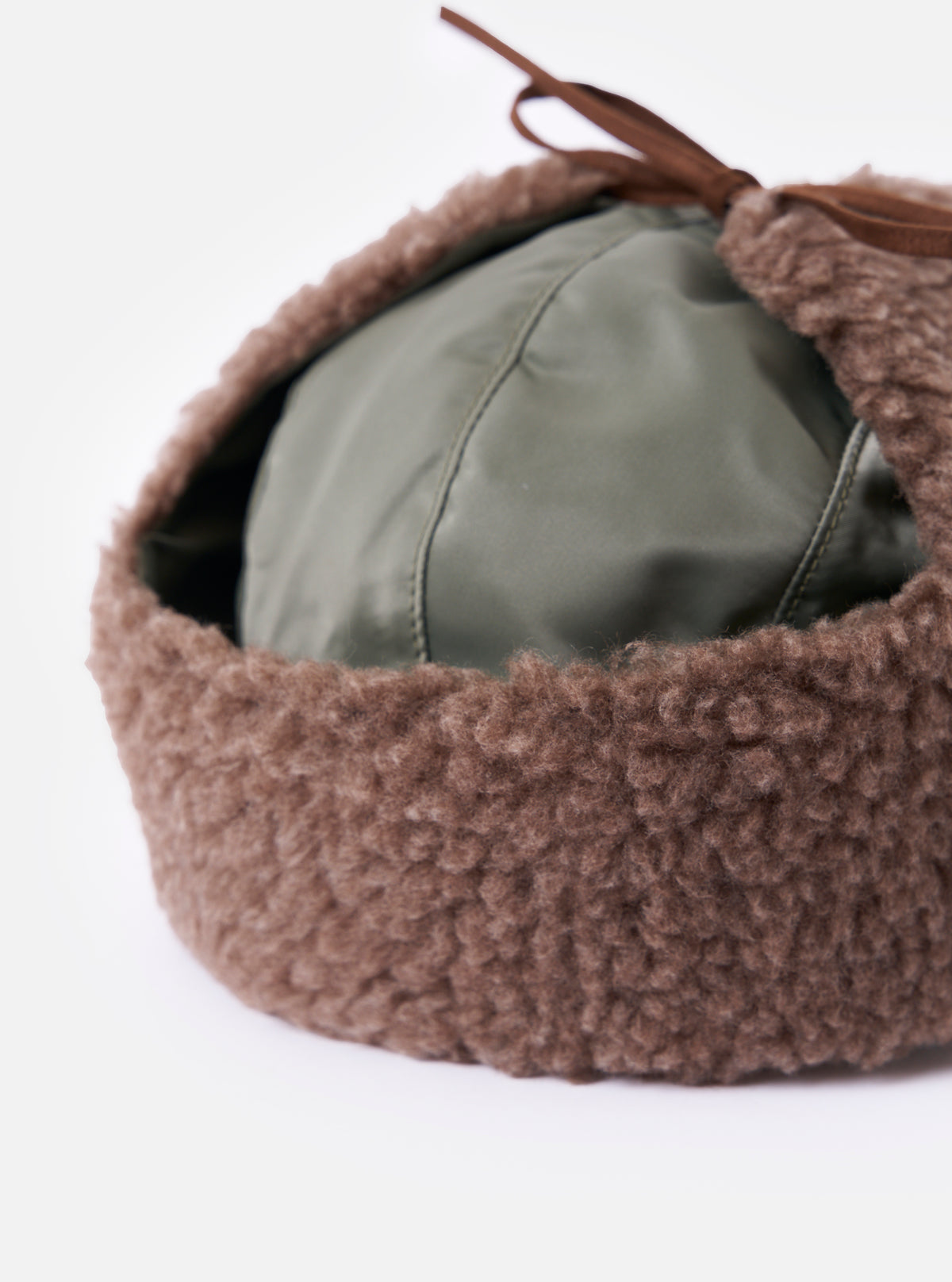 Close-up of the cableami® Olive Military Nylon Twill Boa Aviator hat. Features olive nylon and brown boa trim. Shot on a white background.