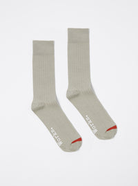 Two grey rib knit modal socks with red accents are displayed on a white background. These Grey Rib Knit Modal Sock are soft and comfortable.
