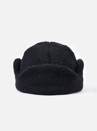 Close-up of the cableami® Black Recycled Wool Flight Watch Cap on a white background. The cap is made of black, textured wool and has a rounded shape.