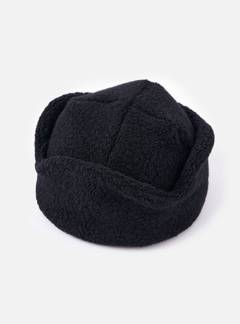 Close-up of the cableami® Black Recycled Wool Flight Watch Cap on a white background. The cap is made of a textured, recycled wool material and has a classic flight watch cap design.