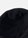 Close-up of the cableami® Black Recycled Wool Flight Watch Cap on a white background. Shows the texture and construction of the cap.
