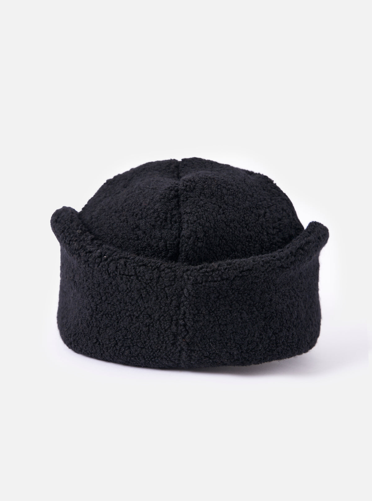 cableami® Black Recycled Wool Flight Watch Cap on a white background. The cap is made of black, textured wool and has a unique, rounded shape.