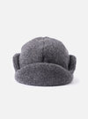 Close-up of the cableami® Grey Recycled Wool Flight Watch Cap on a white background. The cap is a textured grey wool with ear flaps.