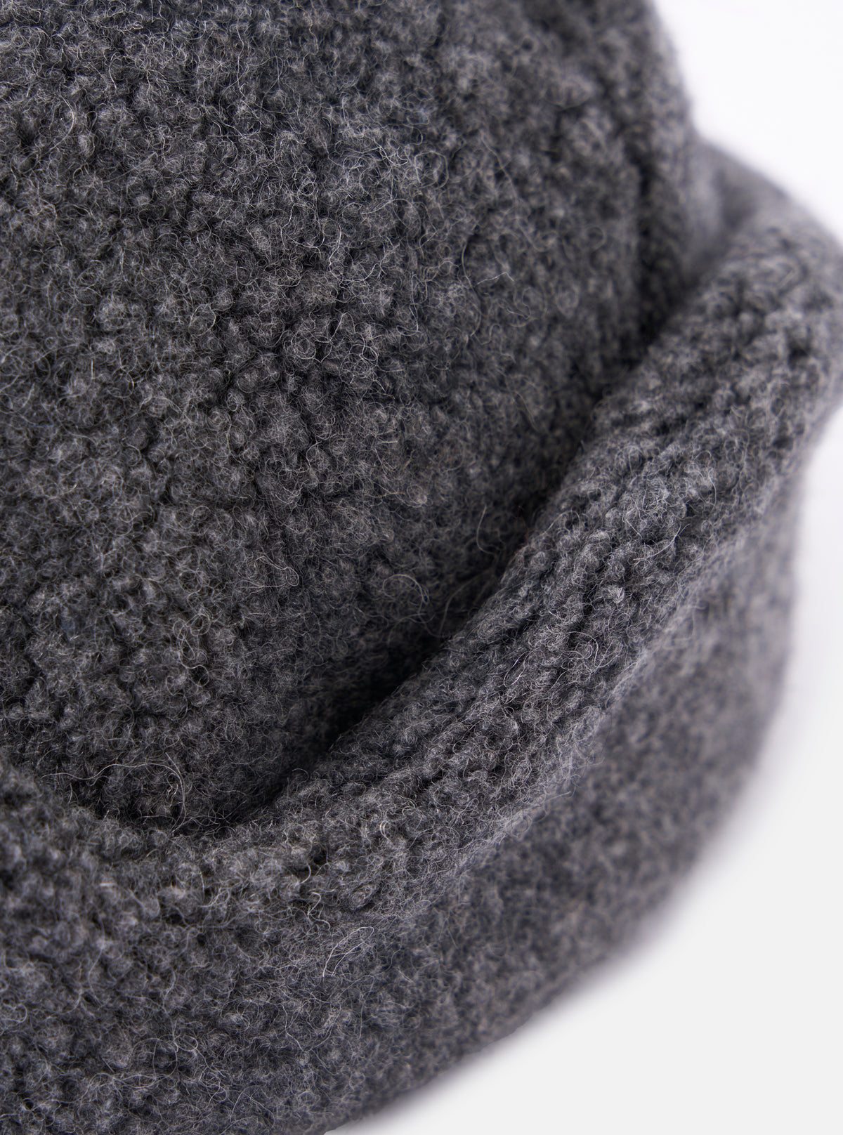 Close-up of the cableami® Grey Recycled Wool Flight Watch Cap showing the texture and construction of the grey wool material. Shot on a white background.