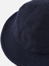 Close-up of the cableami® Navy Recycled Wool Army Hat on a white background. The hat is a deep navy color and made of recycled wool, with a classic army hat fit.