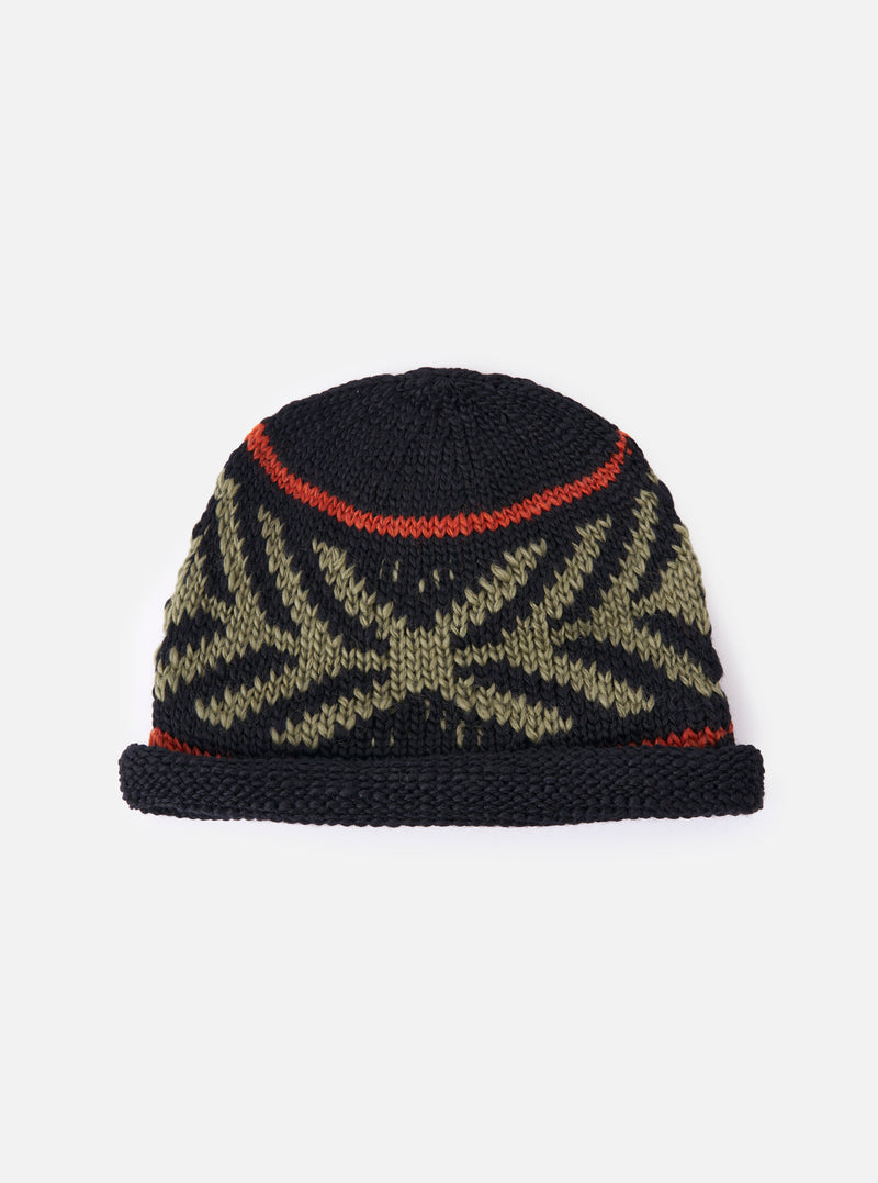 cableami® Black Wool Jacquard Watch Cap on a white background. The cap features a black base with a green jacquard pattern and a red stripe. Warm and stylish.