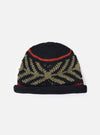 cableami® Black Wool Jacquard Watch Cap on a white background. The cap features a black base with a green jacquard pattern and a red stripe. Warm and stylish.