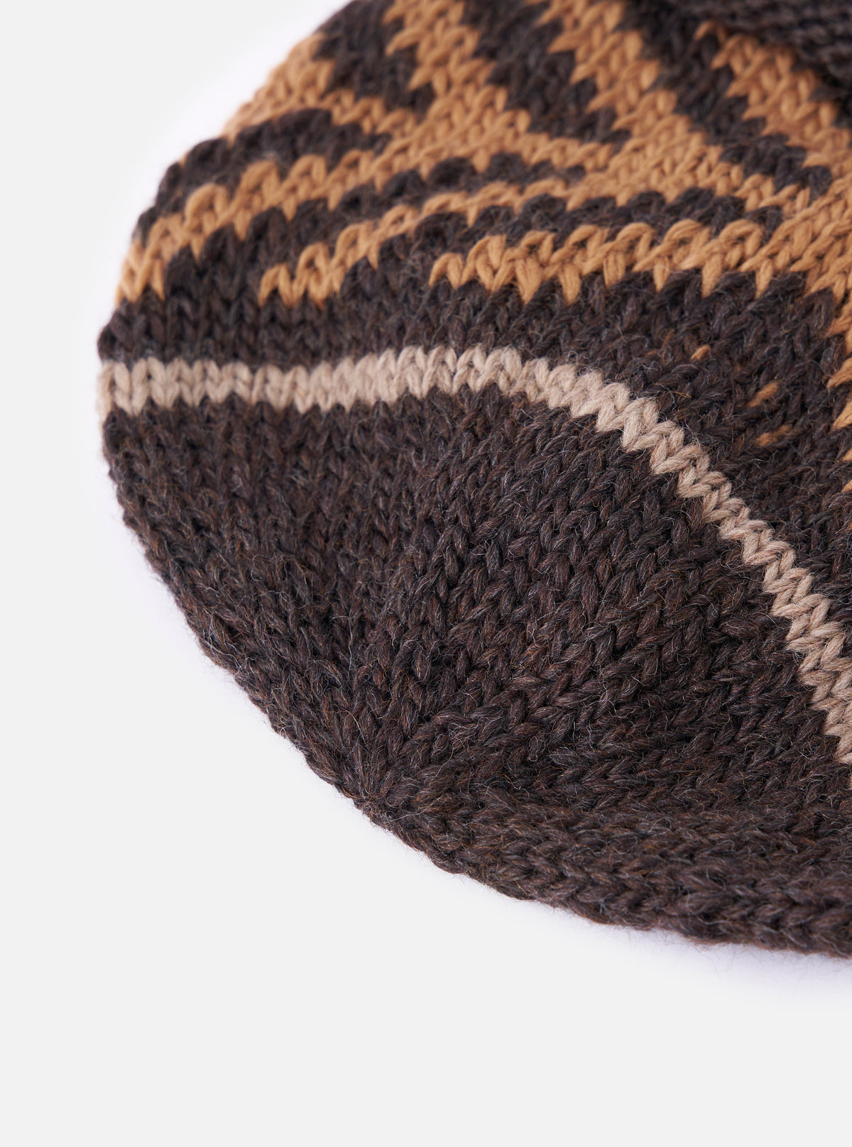 Close-up of a cableami® Brown Wool Jacquard Watch Cap on a white background. The cap features a brown and tan patterned knit.