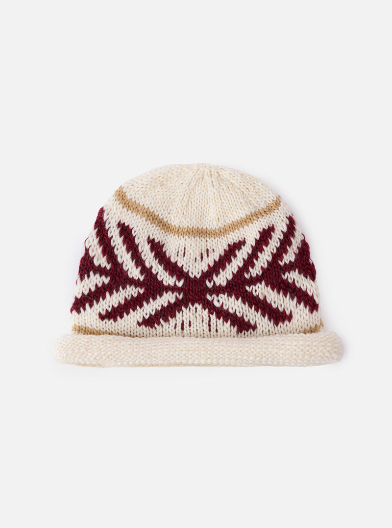 cableami® Ecru Wool Jacquard Watch Cap on a white background. The cap is ecru with a red and white geometric pattern and a tan stripe.