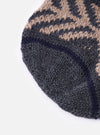 Close-up of the cableami® Grey Wool Jacquard Watch Cap on a white background. The cap features a grey and beige patterned knit with a navy stripe.