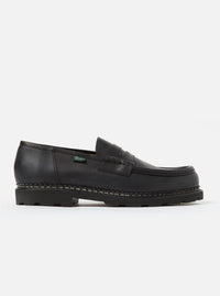 Studio shot of a Paraboot Black Leather Reims Marche shoe. The black leather loafer has a thick sole. Clean white background.