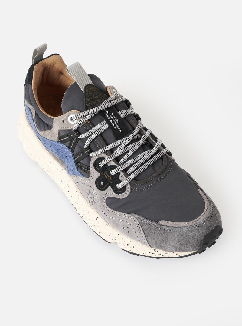 Side profile view of the Flower Mountain Dark Grey/Grey/Navy Suede/Nylon Yamano 3 Man sneaker set against a plain off-white background. Highlights include the navy and grey suede overlays, durable nylon base, unique lacing, and trek sole.