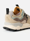 Back heel detail shot of the Flower Mountain Sand/Beige/Taupe Cow Velour Yamano 3 Uni sneaker against a plain light background. Features a leather pull tab, reinforced velour heel cup, layered taupe panels, and thick rubber outsole edge.
