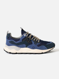 Side profile view of the Flower Mountain Blue/Bluette Cow Velour Yamano 3 Man sneaker set against a plain studio background. Showcases vibrant blue cow velour uppers, bluette overlays, trek-style eyelets, and a thick cushioned outsole.