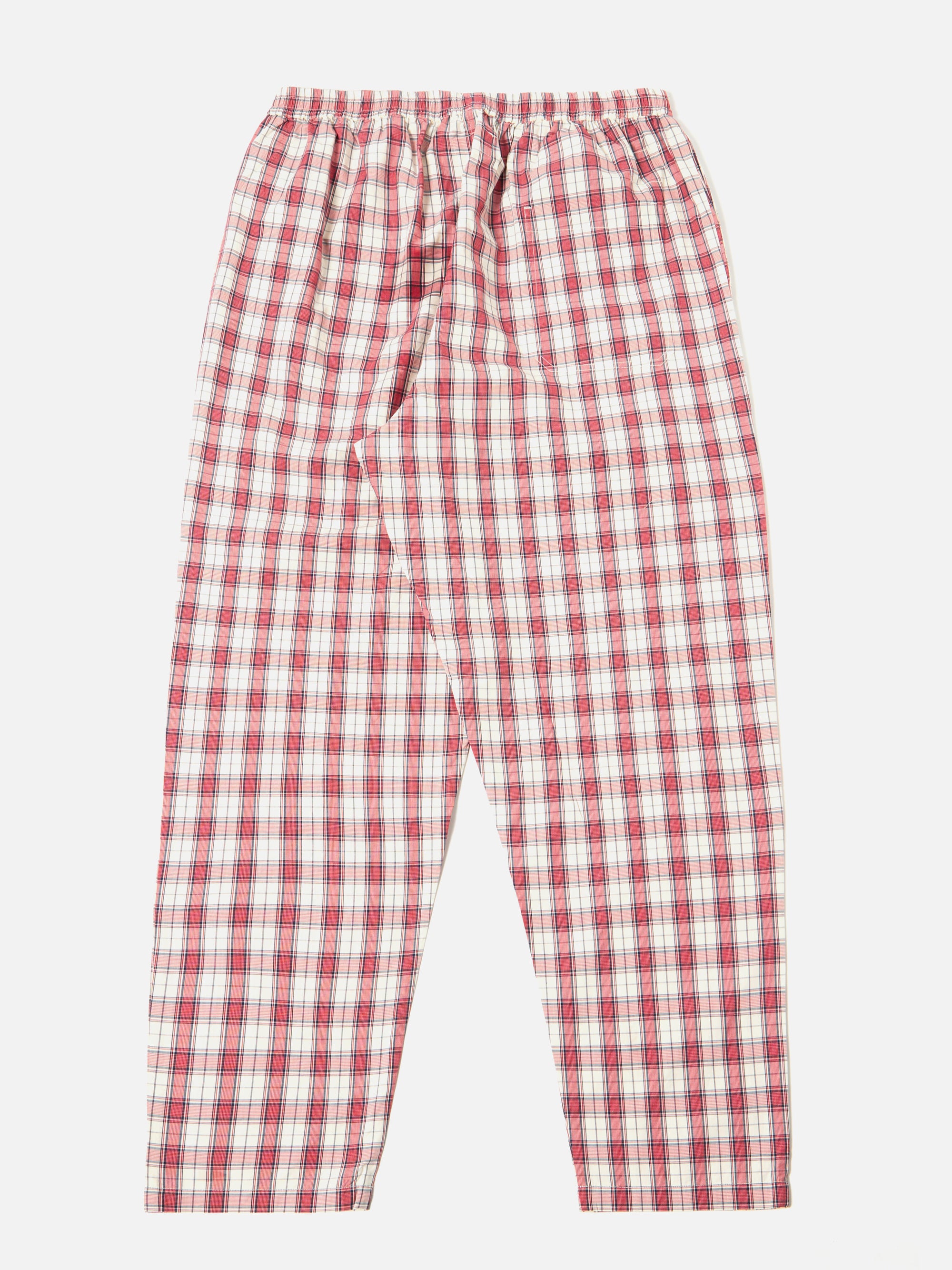 The red cotton check pyjama pant is laid flat on a white background. The relaxed-fit pants feature a red and white plaid pattern and an elastic waistband.