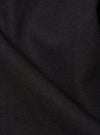 Close-up of the Black Twill Field Waistcoat. The dark, textured twill fabric is neatly folded, showcasing its durable weave. Ideal for a sophisticated, layered look.