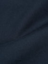 A pair of navy blue twill oxford pants is shown laid flat against a plain white background. The trousers feature a wide leg, a pleated front, and a drawstring waistband.