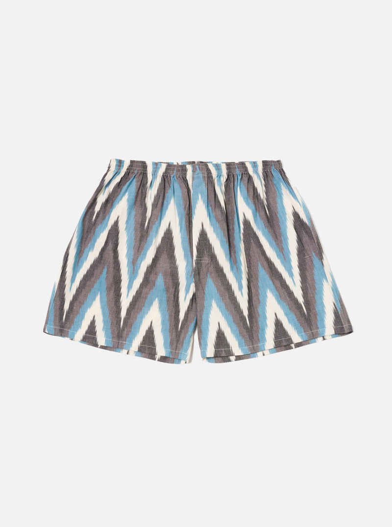 The Ecru Ikat II Cotton Boxer Short on a white background. The shorts have a blue, gray, and white ikat pattern and an elastic waistband.