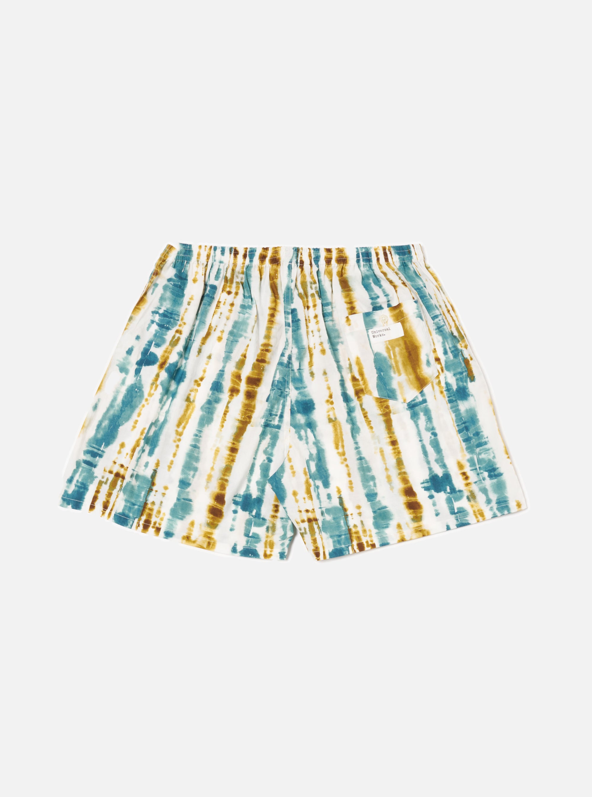 The Ecru Paint Print Boxer Short, featuring a blue and brown tie-dye pattern on a white background. The shorts are displayed on a white surface.
