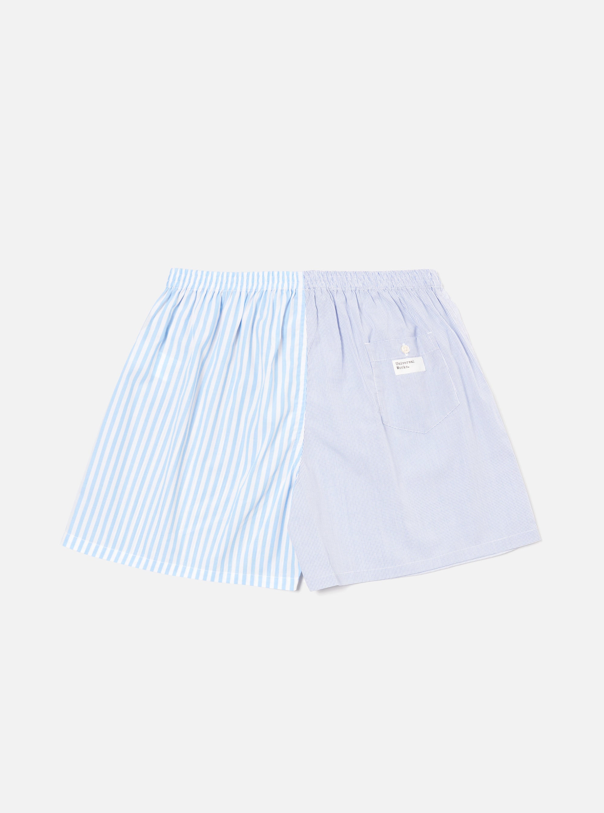 The Blue Classic Mix Boxer Short on a white background. The short is made of blue and white striped and checkered fabric with an elastic waistband.