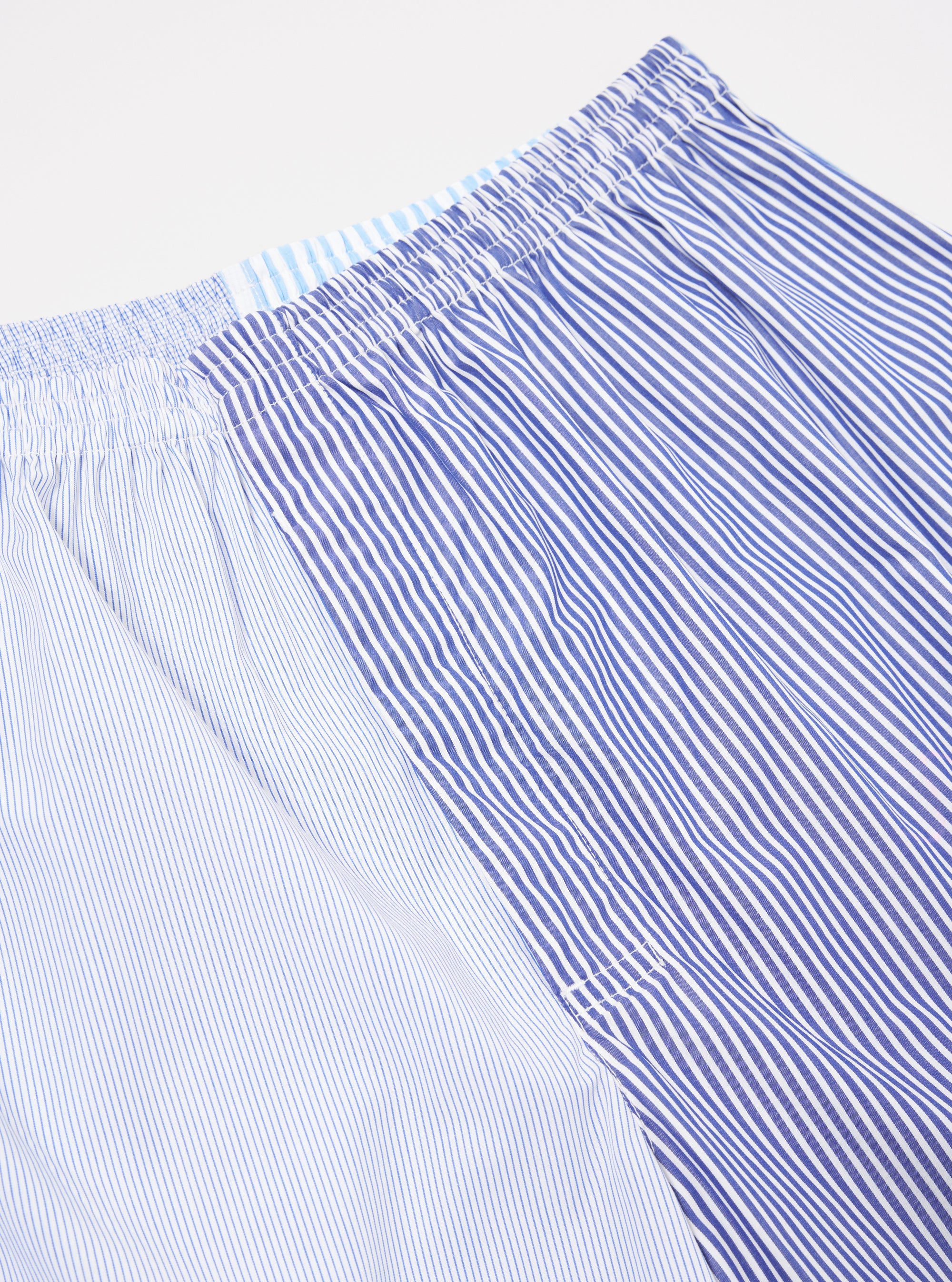 Close-up of Blue Classic Mix Boxer Short on a white background. Features blue and white striped patterns and an elastic waistband.