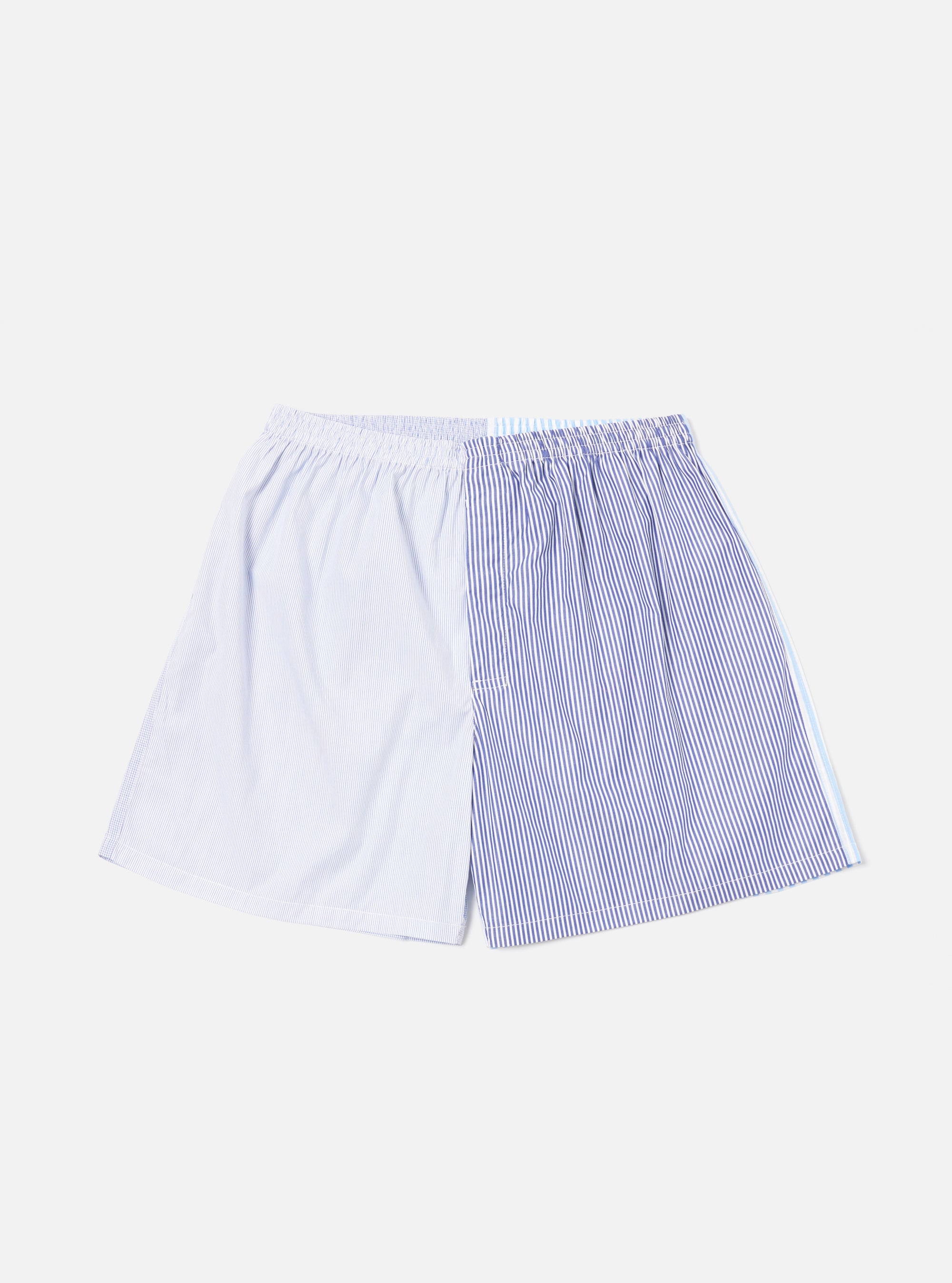 On a white background, a Blue Classic Mix Boxer Short. The short is striped with blue and white. The left side has light blue stripes, and the right side has dark blue stripes.