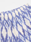 Close-up of the Ecru Ikat I Cotton Boxer Short. The cotton fabric features a blue ikat pattern on an ecru background. The shorts have an elastic waistband. Shot on white.