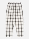 The Ecru Shadow Check Pyjama Pant, featuring a relaxed fit. The pants are ecru with a shadow check pattern. Shot on a white background.