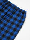 Close-up of the Blue Brushed Bold Gingham Pyjama Pant on a white surface, showing the elastic waistband and pocket detail.