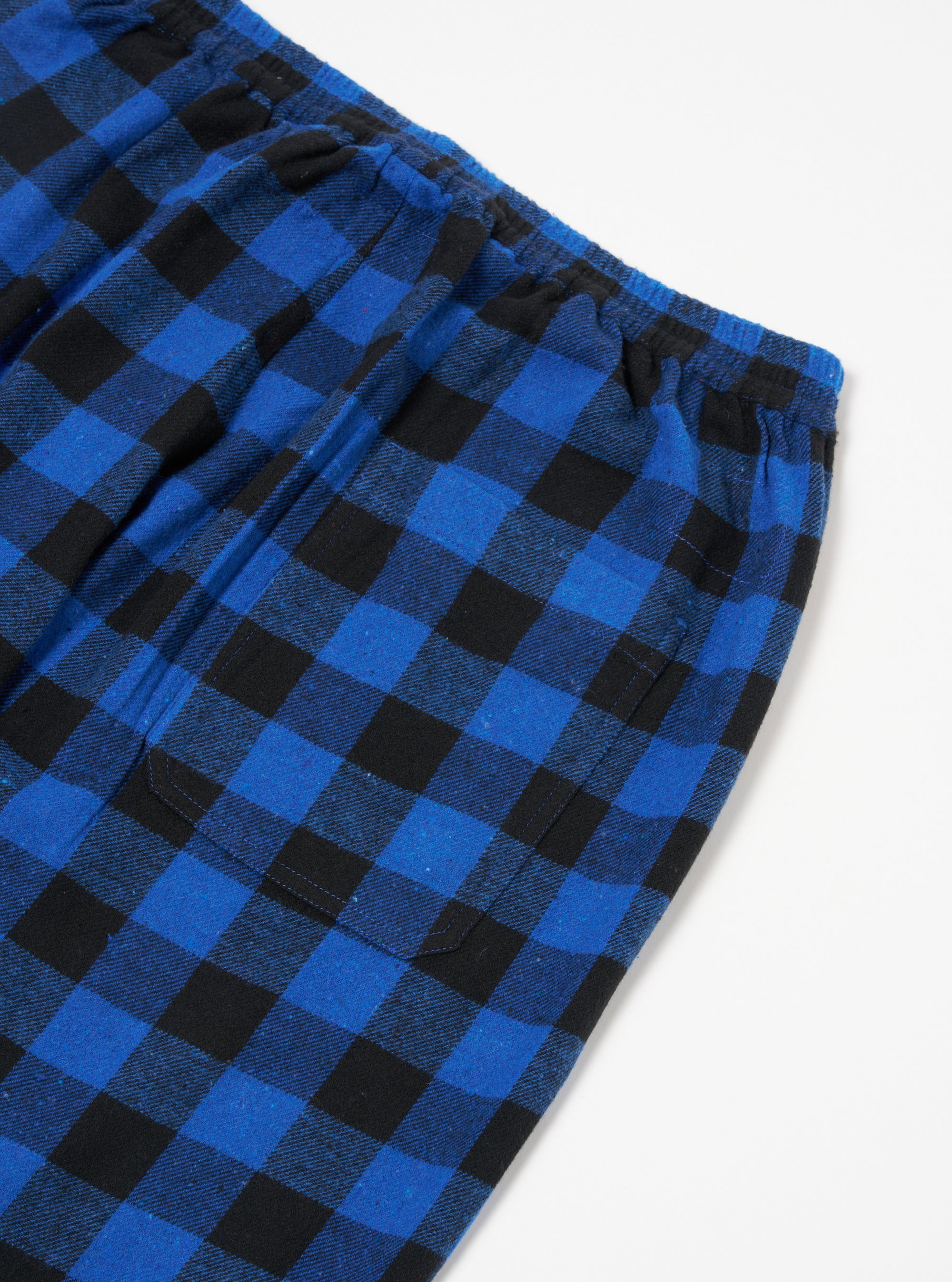 Close-up of the Blue Brushed Bold Gingham Pyjama Pant on a white surface, showing the elastic waistband and pocket detail.