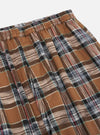 Close-up of the Brown Ikat Twill Check Long Pyjama Set. Features a brown, black, white, and red plaid pattern. The fabric is soft and comfortable, perfect for lounging.