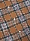 Close-up of the Brown Ikat Twill Check Long Pyjama Set. The fabric is a brown, white, black, and red plaid with white buttons.
