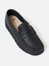 Close-up of a Zardus for Universal Works Black Leather Reggie Loafer on a white background. The shoe is black leather with a black sole.