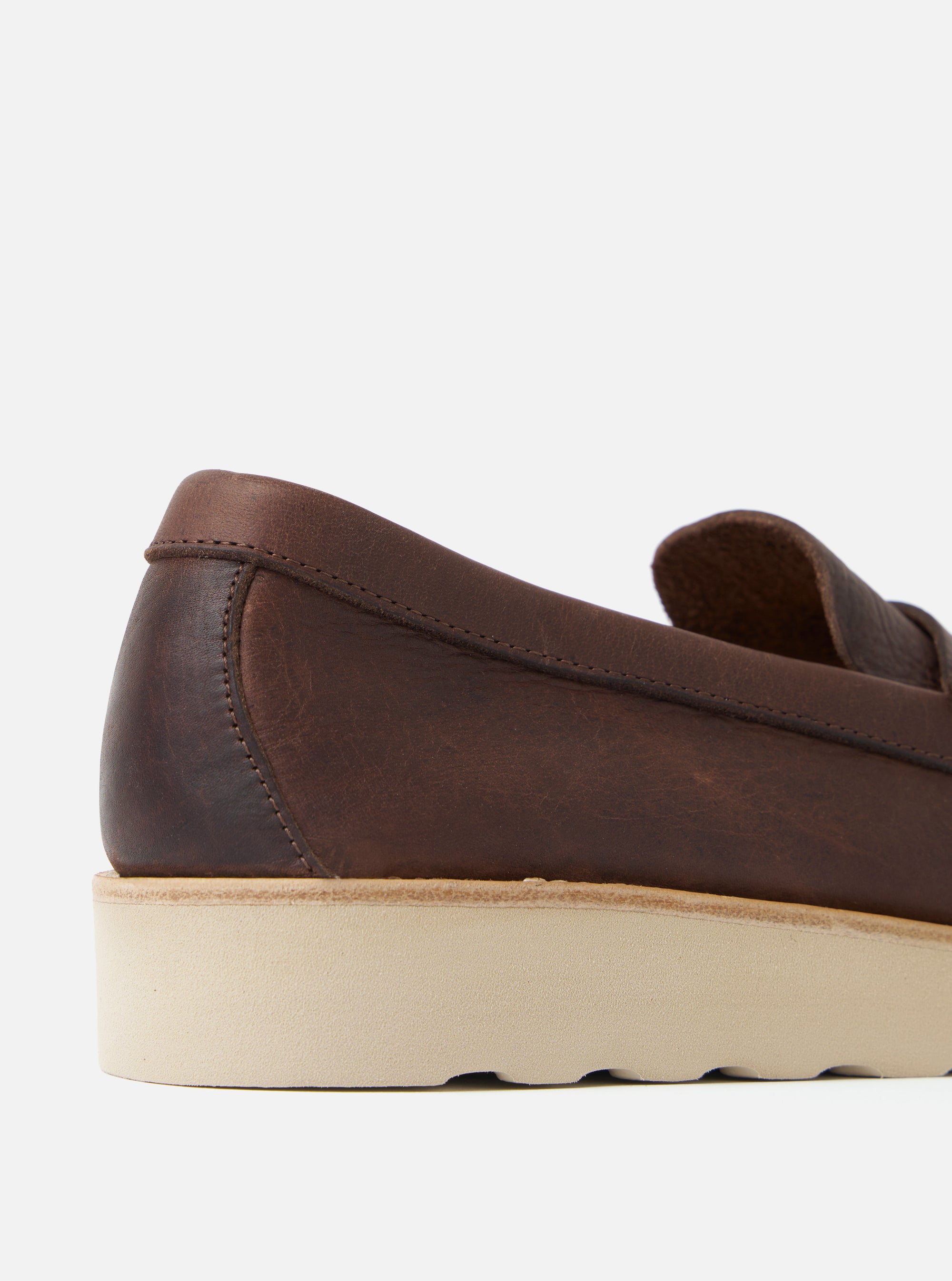 Close-up of the Zardus for Universal Works Brown Leather Reggie Loafer. The brown leather upper sits atop a thick, light beige sole. Shot in a bright studio.
