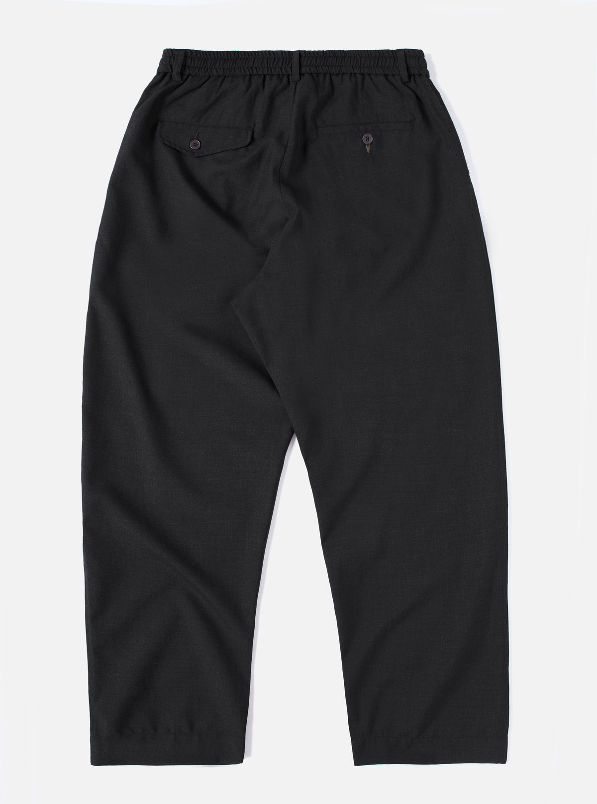The Charcoal Tropical Suiting Oxford Pant in dark gray on a white background. The pants have a relaxed fit and visible back pockets.