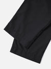 Close-up of the Charcoal Tropical Suiting Oxford Pant on a white background. The dark, tailored trousers are neatly folded, showcasing the fabric and fit.
