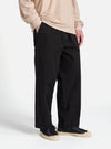 The Black Kelly Cotton Judo Pant is shown as a flat lay against a plain white background. The trousers feature a wide, straight-leg silhouette with an elasticated waistband and a tonal drawstring. Two front patch pockets are visible, and the heavy-duty cotton fabric has a matte black finish.