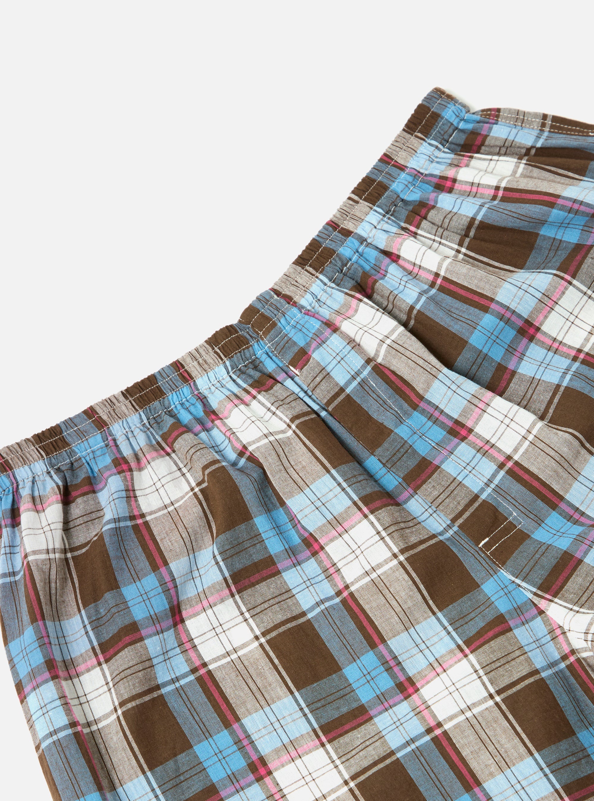 Close-up of Blue/Brown Check 3 Boxer Short on a white background. The fabric is a plaid pattern with blue, brown, pink, and white. The boxer shorts have an elastic waistband.